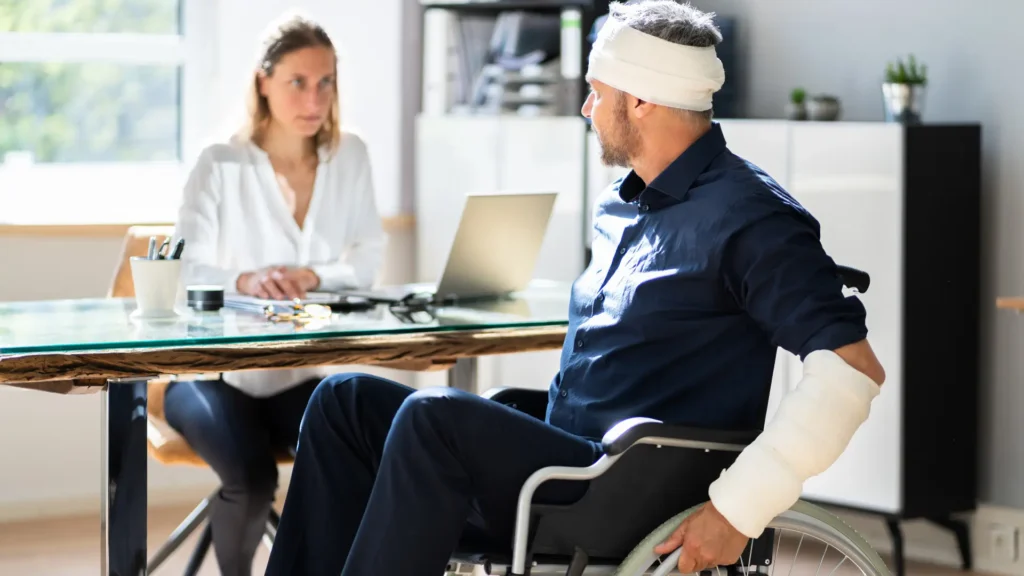 a cruise ship passenger on a wheelchair with body injuries speaking to a cruise ship passenger claims lawyer