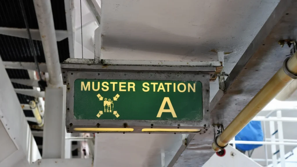 muster station sign on a cruise ship muster station
