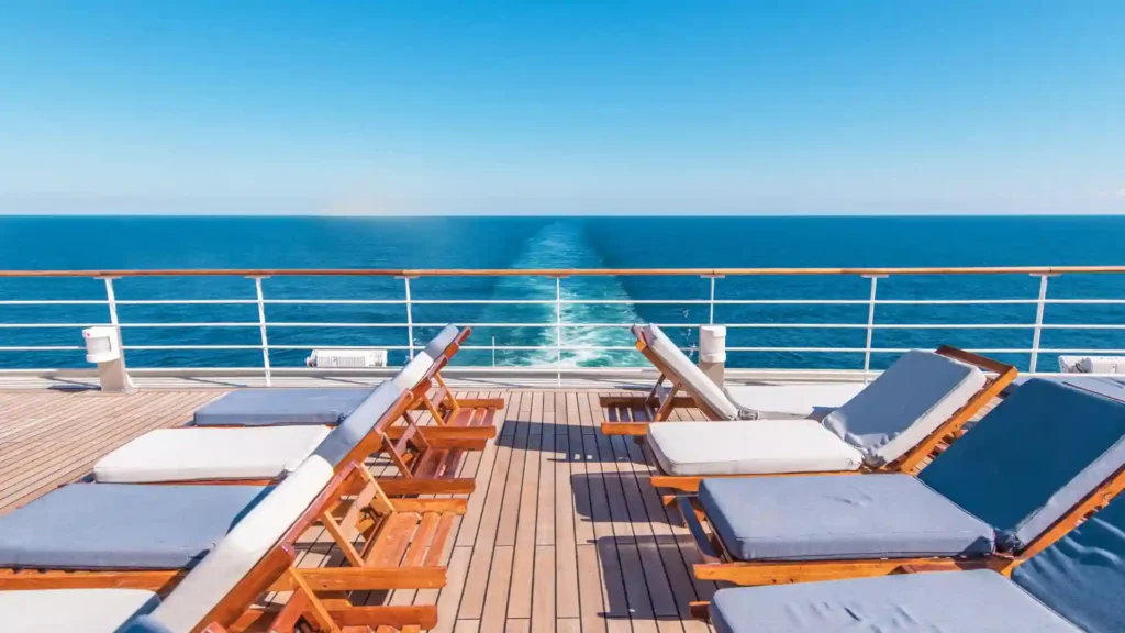 cruise ship deck with lounge chairs and an ocean view