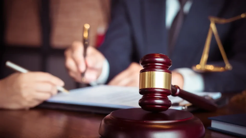a cruise ship injury lawyer and their client signing legal paperwork