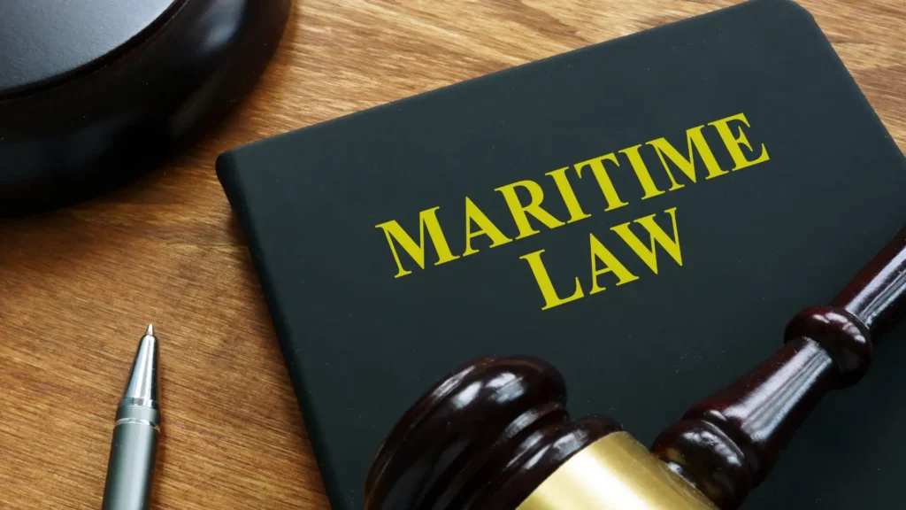 maritime law text book with gavel of justice on top of it
