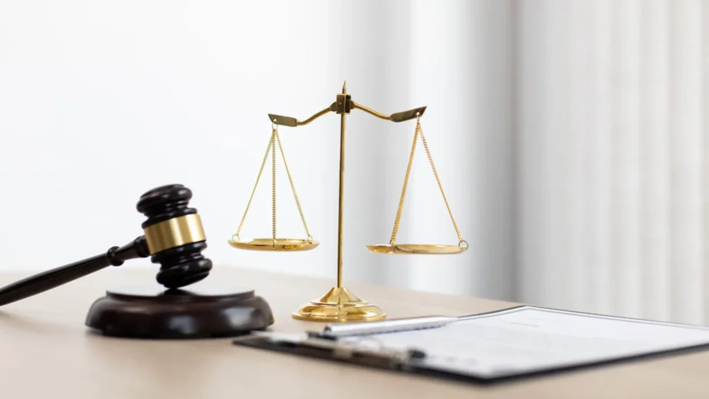 gavel of justice and scales of justice on a table